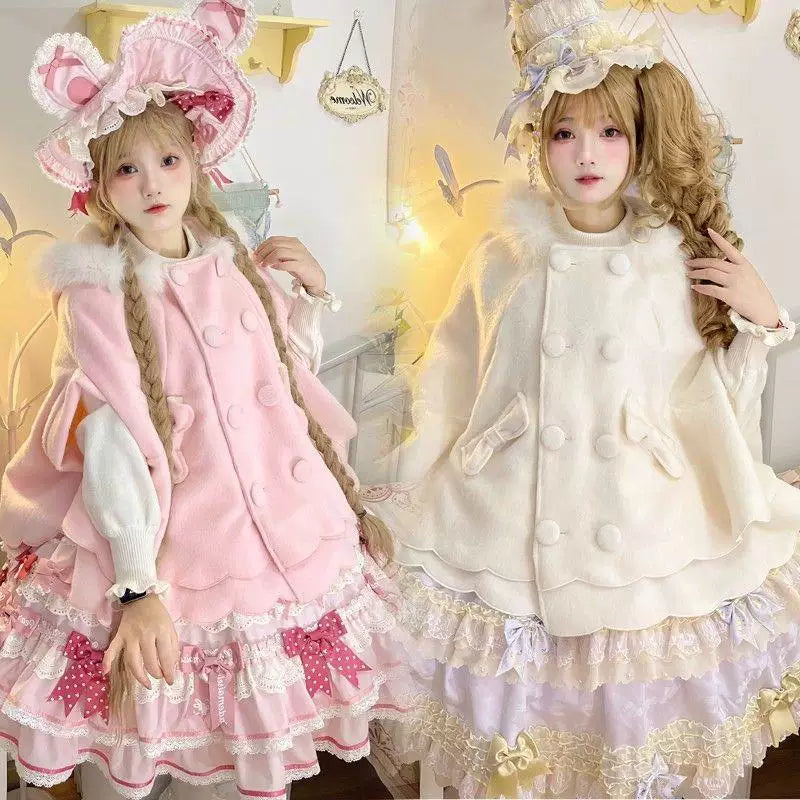 Pink cape-style coat with batwing sleeves and a layered scalloped hem worn in a Lolita coordinate
