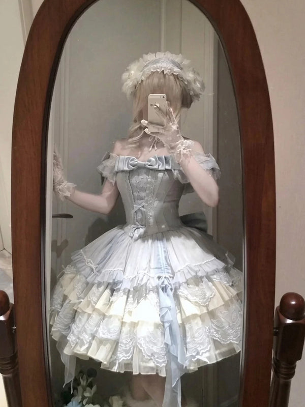 Front view of blue balletcore sweet lolita JSK with train and satin bust bow
