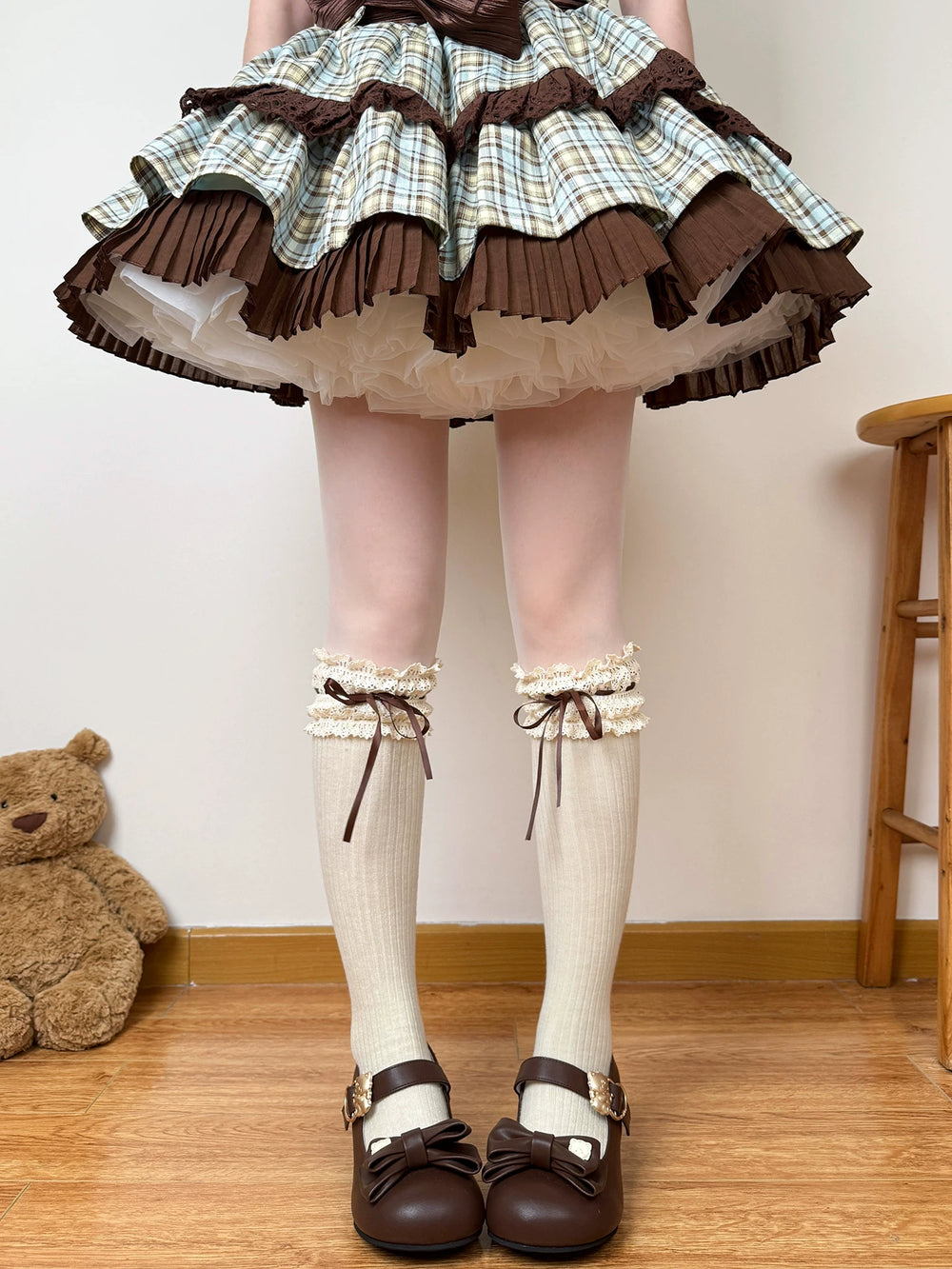 Lace-trimmed bow socks worn with a brown Lolita skirt