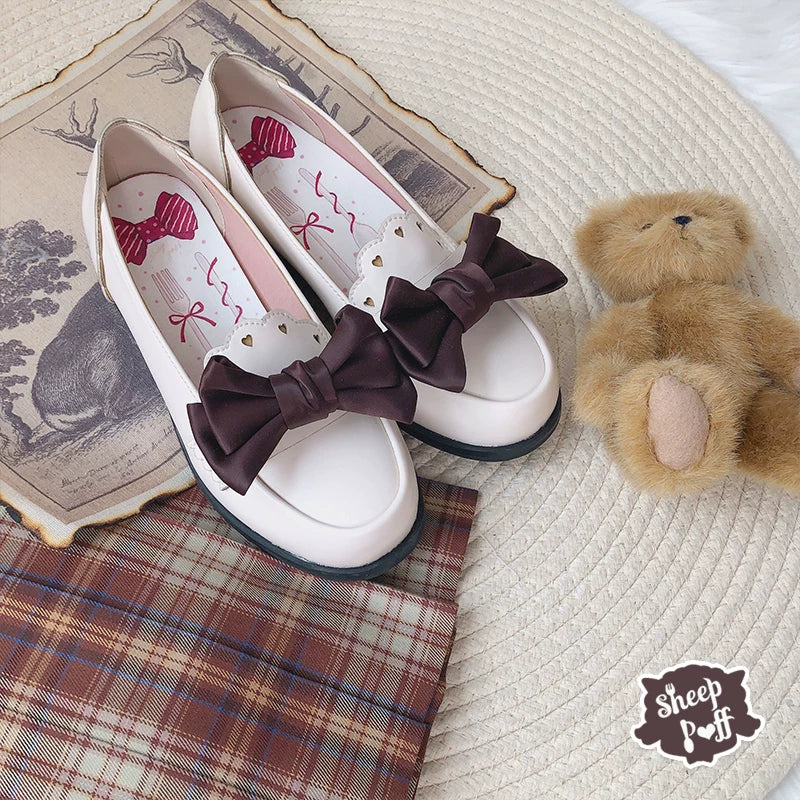 Sheep Puff brand sheep-shaped puff bow shoe clips accessory attached to a shoe, adding a playful decorative touch.