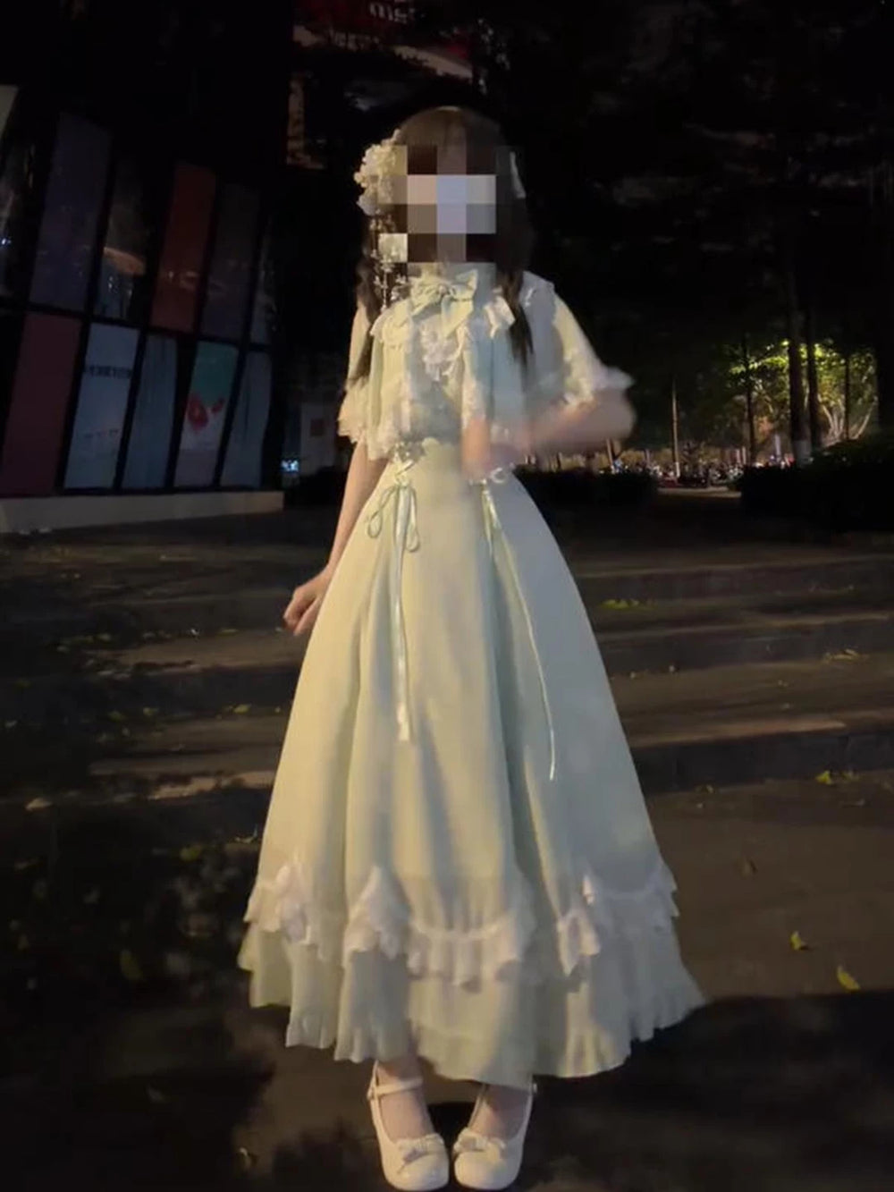 Green Lolita dress with lace capelet and layered ruffled hem