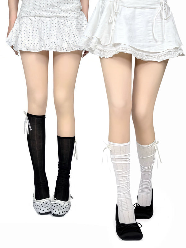 White, grey or black slouch socks with vertical stripes and lace bows