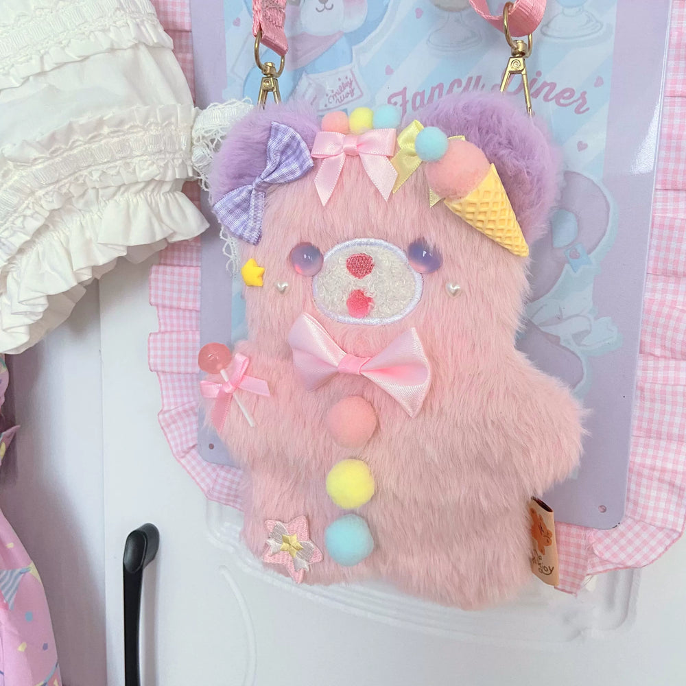 Pink plush bear crossbody bag with a pink strap.