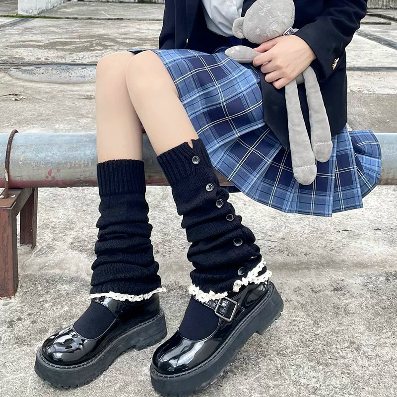 Black gathered slouch leg warmers with side buttons styled with patent Mary Jane shoes