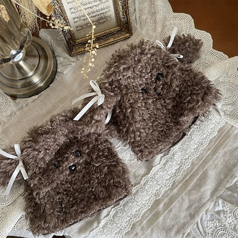 Brown ribbed socks with white lace cuffs and ribbon ties worn with dark shoes.