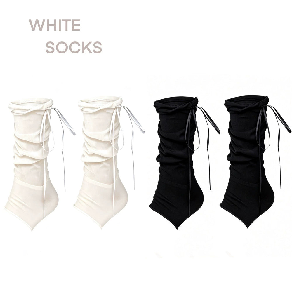 White, black, and pink mid-calf stirrup slouch socks with gathered ruffles and long ribbon ties