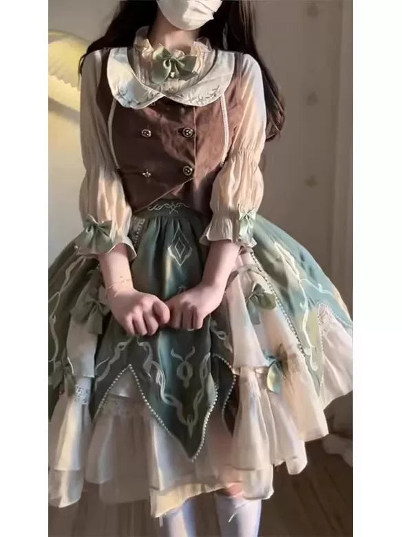Green, brown and white vest, shirt and short skirt set with bow accents.