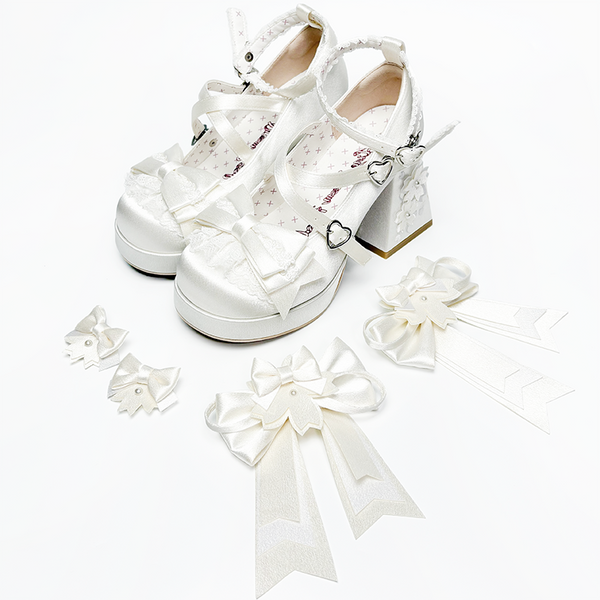 White satin Lolita shoes with bows, floral details and detachable accessories.