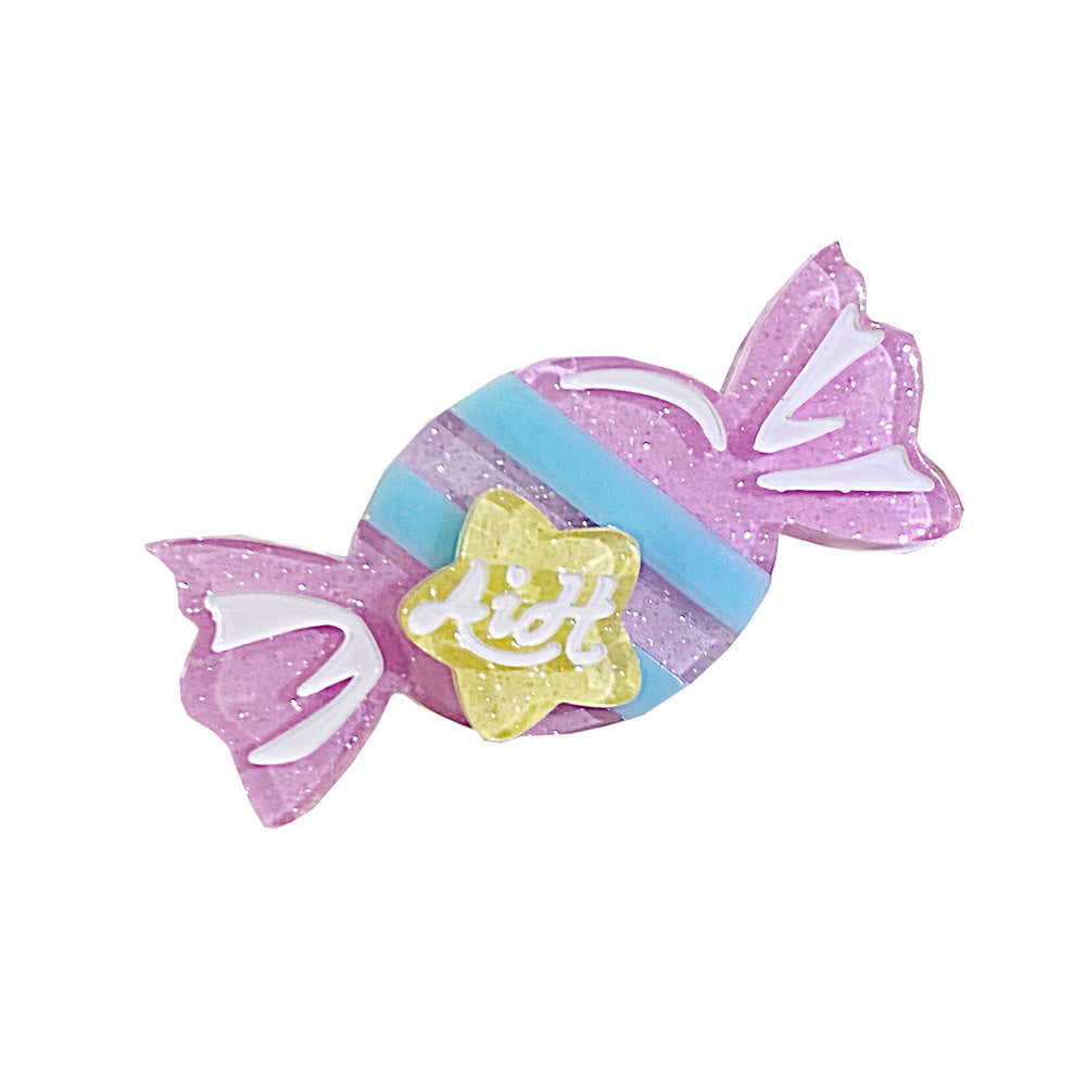 Candy-shaped plastic Lolita accessory in pastel purple, blue and yellow.