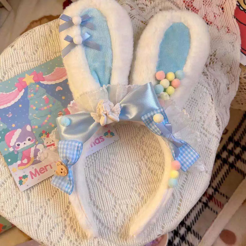 Pastel rabbit-ear headband with blue gingham bows and pom-poms