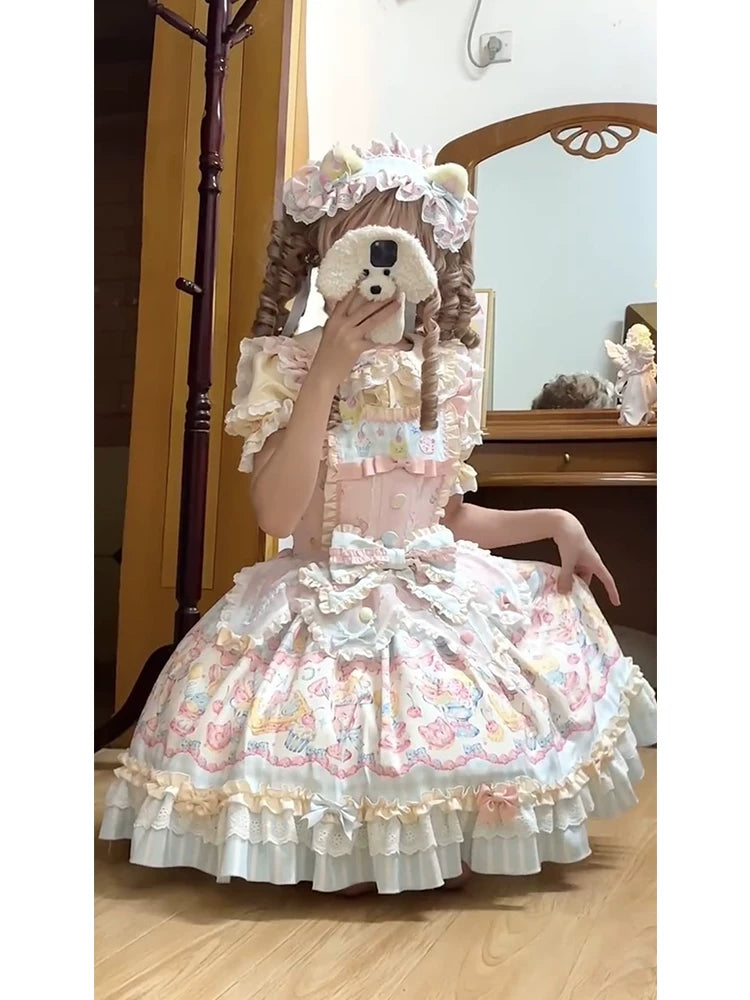 Blush pink Sweet Lolita OP dress with tiered novelty print skirt, sweetheart neckline, and matching bonnet headdress with bear ears