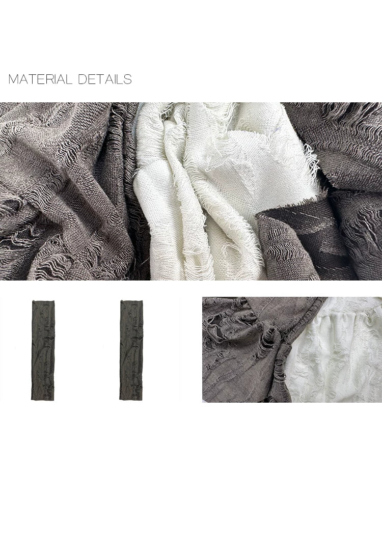 Gray-brown distressed arm sleeves with cutout texture shown beside white fabric.