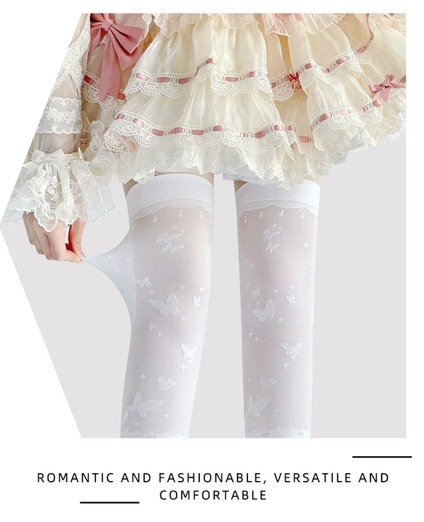 White butterfly-motif over-the-knee stockings shown on a model beneath a pink ruffled skirt.