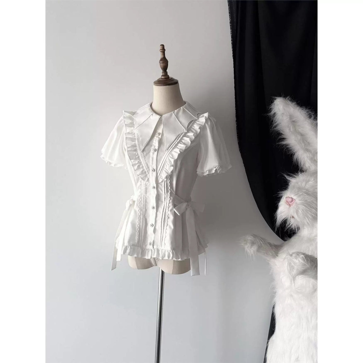 White and black Lolita blouses with batwing collars and ruffled fronts