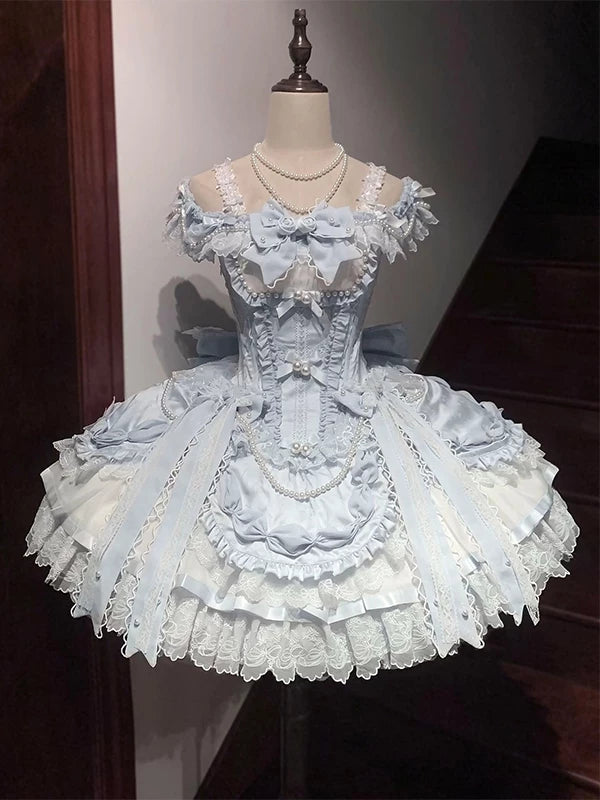Blue Lolita fashion set with layered lace, pearl accents and a large back bow