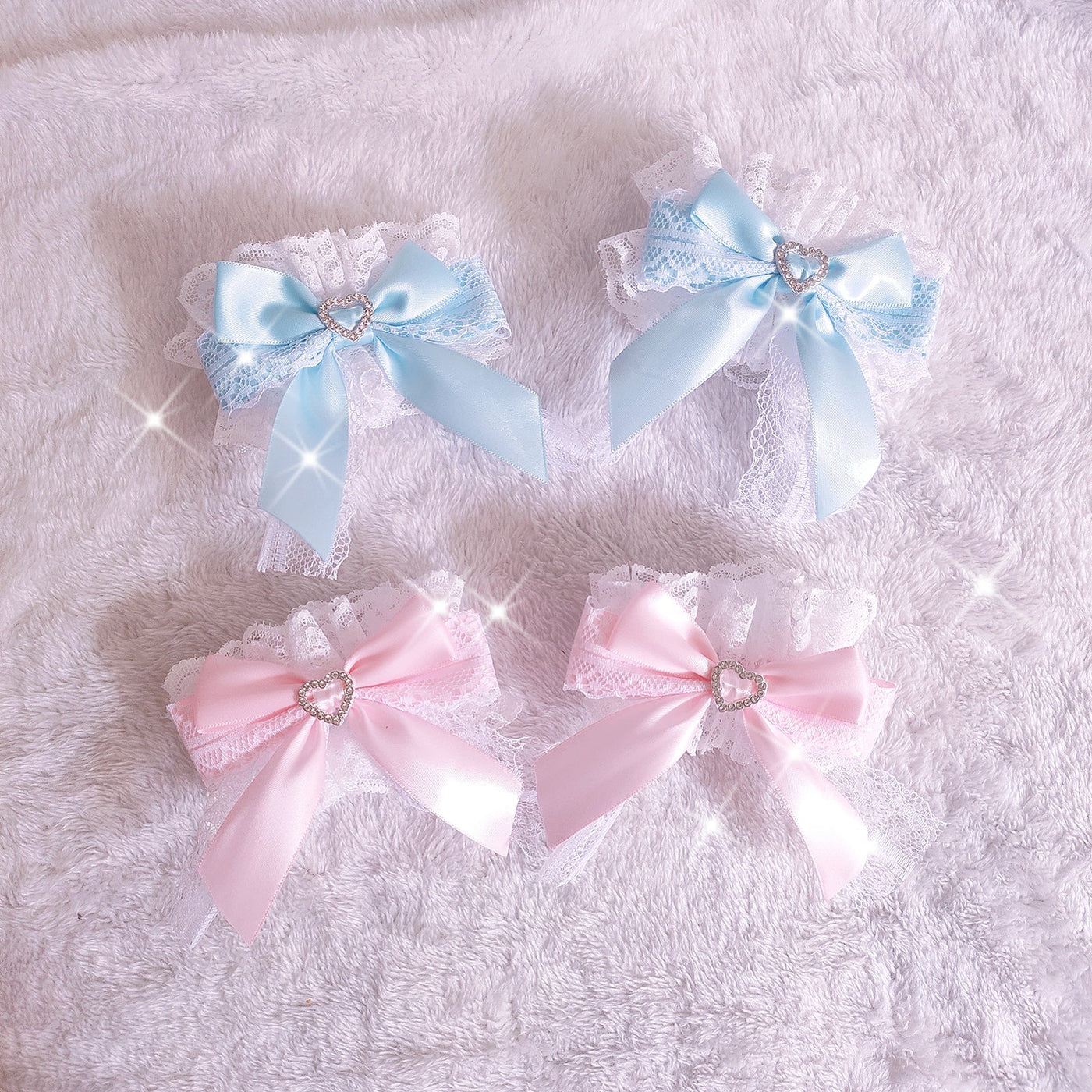Blue and pink lace bow cuff colorways with heart accents
