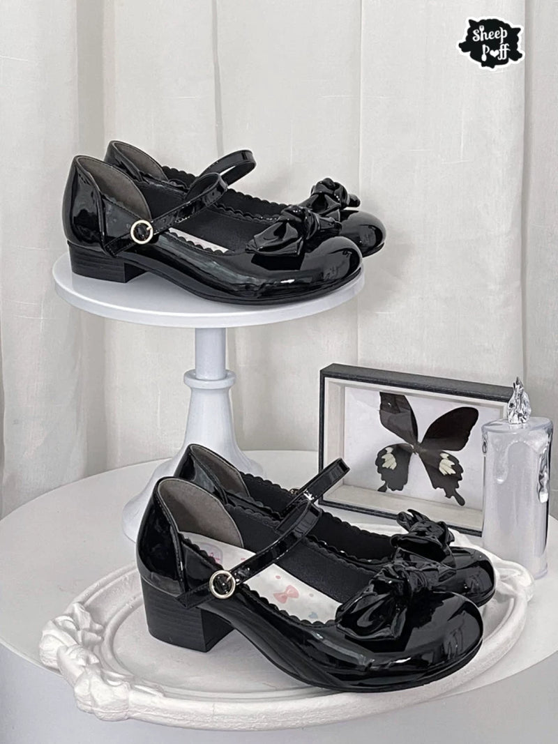 Sheep Puff rounded bow patent Lolita shoes in black with a puffed toe and decorative bow, stylish and feminine footwear.