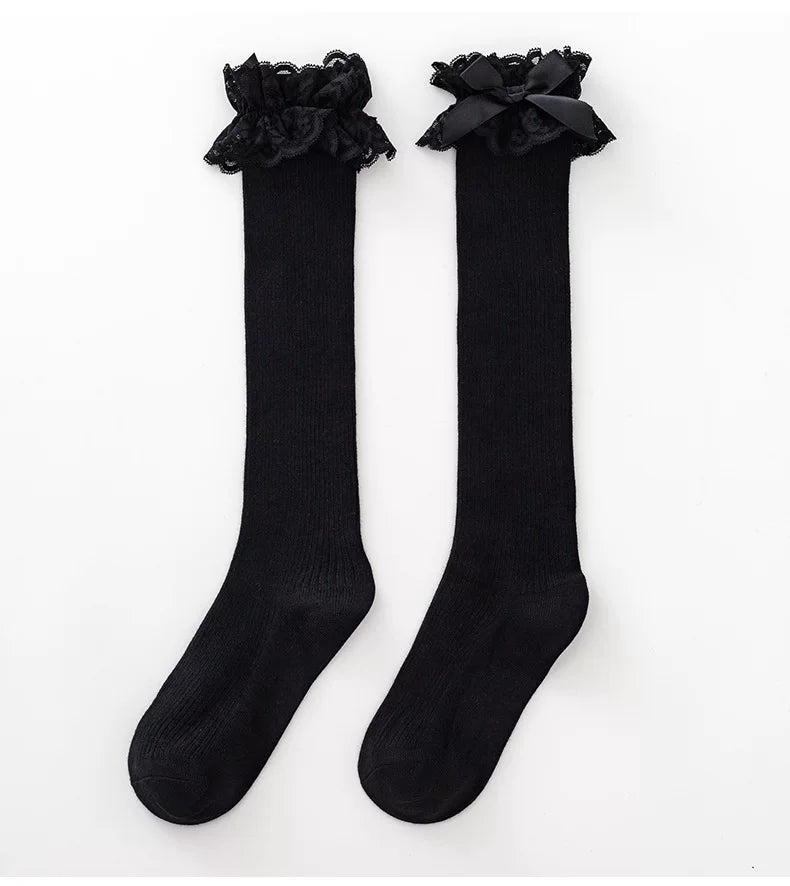 White and black ribbed mid-calf socks with lace bow cuffs