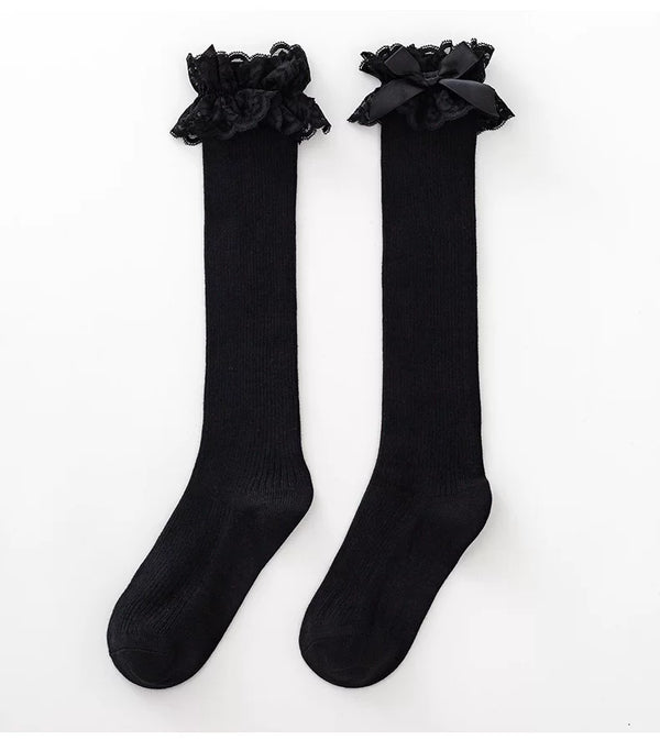 White and black ribbed mid-calf socks with lace bow cuffs
