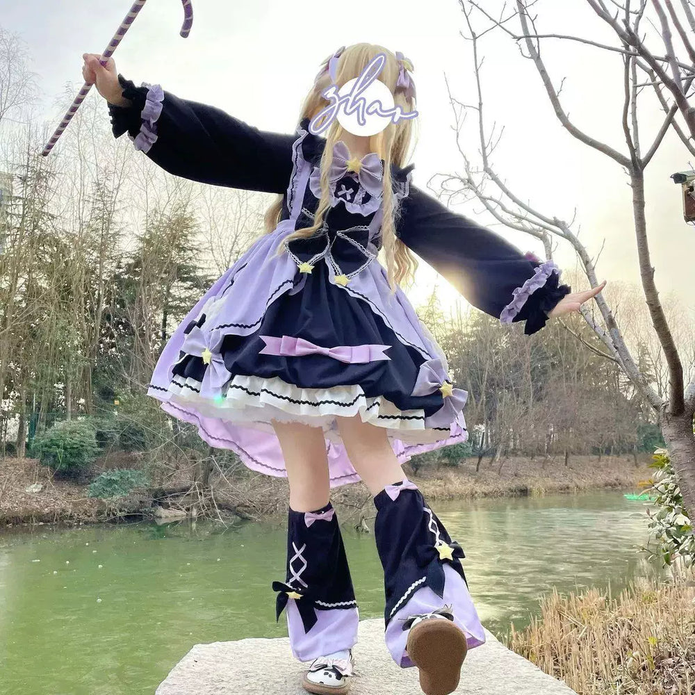 Long-sleeve Lolita OP dress with waist bow, Peter Pan collar, and tiered contrasting black and white skirt