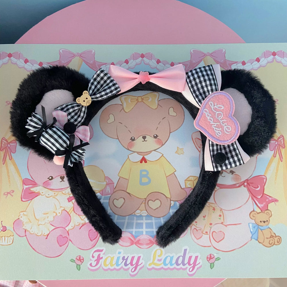 Black plush ear headband with gingham bows, pink ribbon and teddy-bear charms.