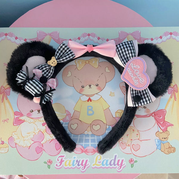 Black plush ear headband with gingham bows, pink ribbon and teddy-bear charms.