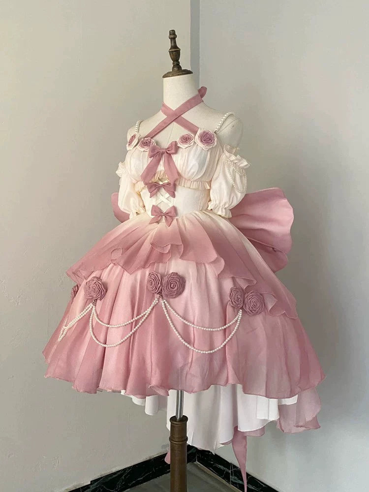 Pink gradient high-low Lolita dress with rose details and pearl chains on a mannequin.