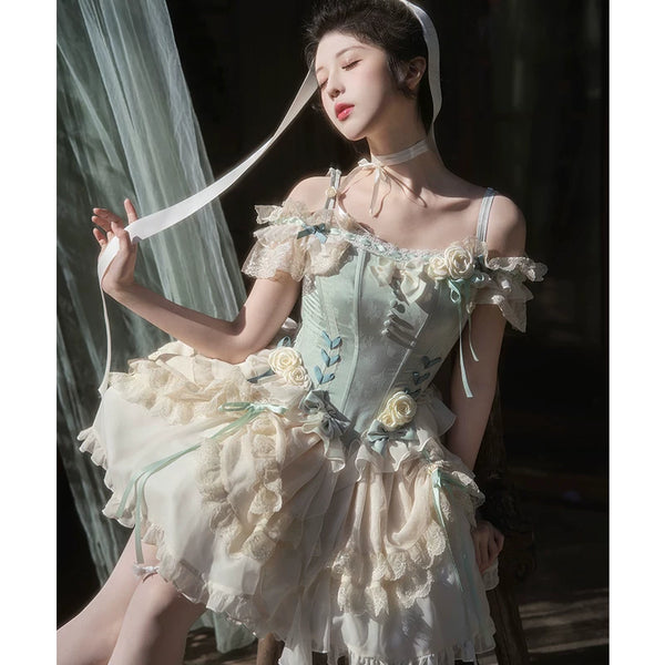 Light green ballet-style JSK dress with lace ruffles and a layered pale skirt on a model.