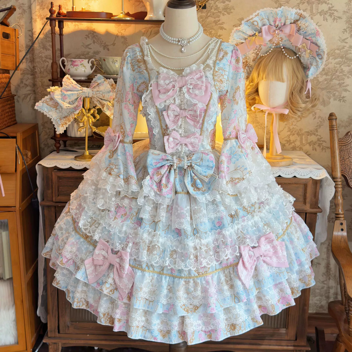 Lady Han Sweet OP dress by Lolita Fetch featuring a candelabra chapter design, displayed on a mannequin with intricate lace and bow details.
