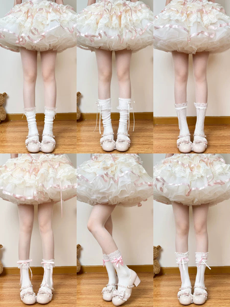 Cream and white layered lace socks with pink bows and ribbon trims.