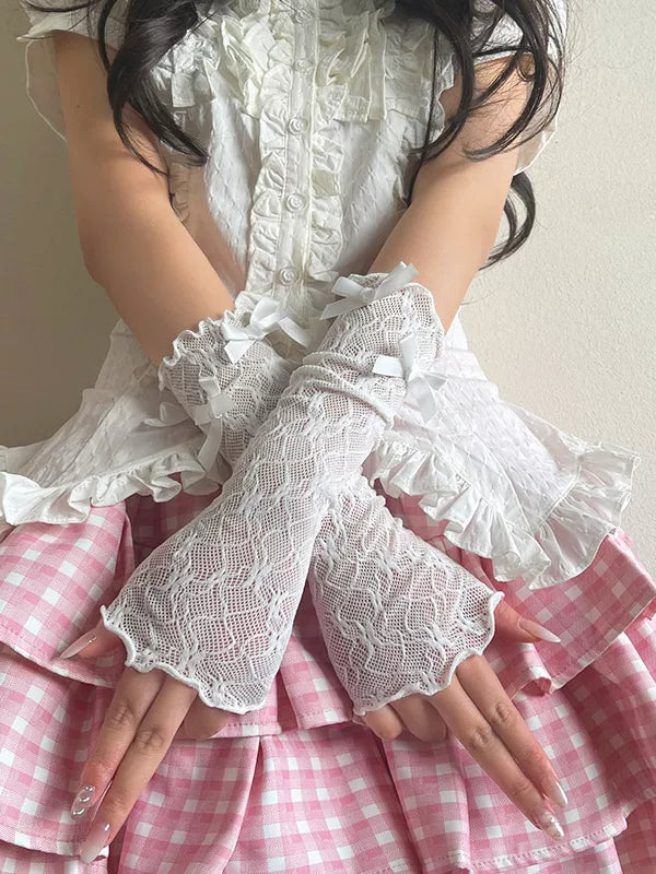 White lace arm sleeve with scalloped ruffles and small bow ties.