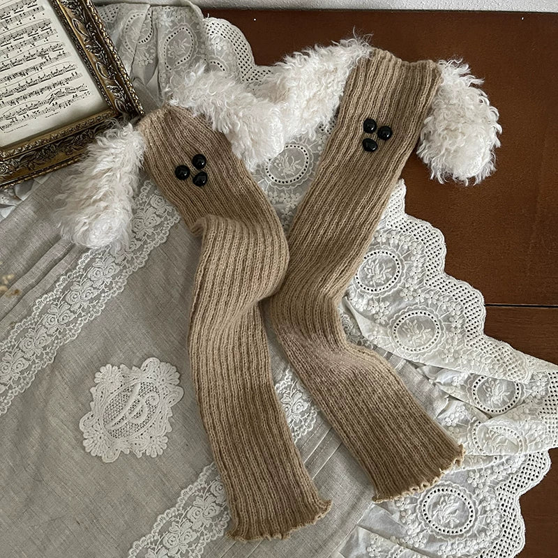 Khaki striped Cinnamoroll and white teddy sock covers with plush ear details styled on legs.
