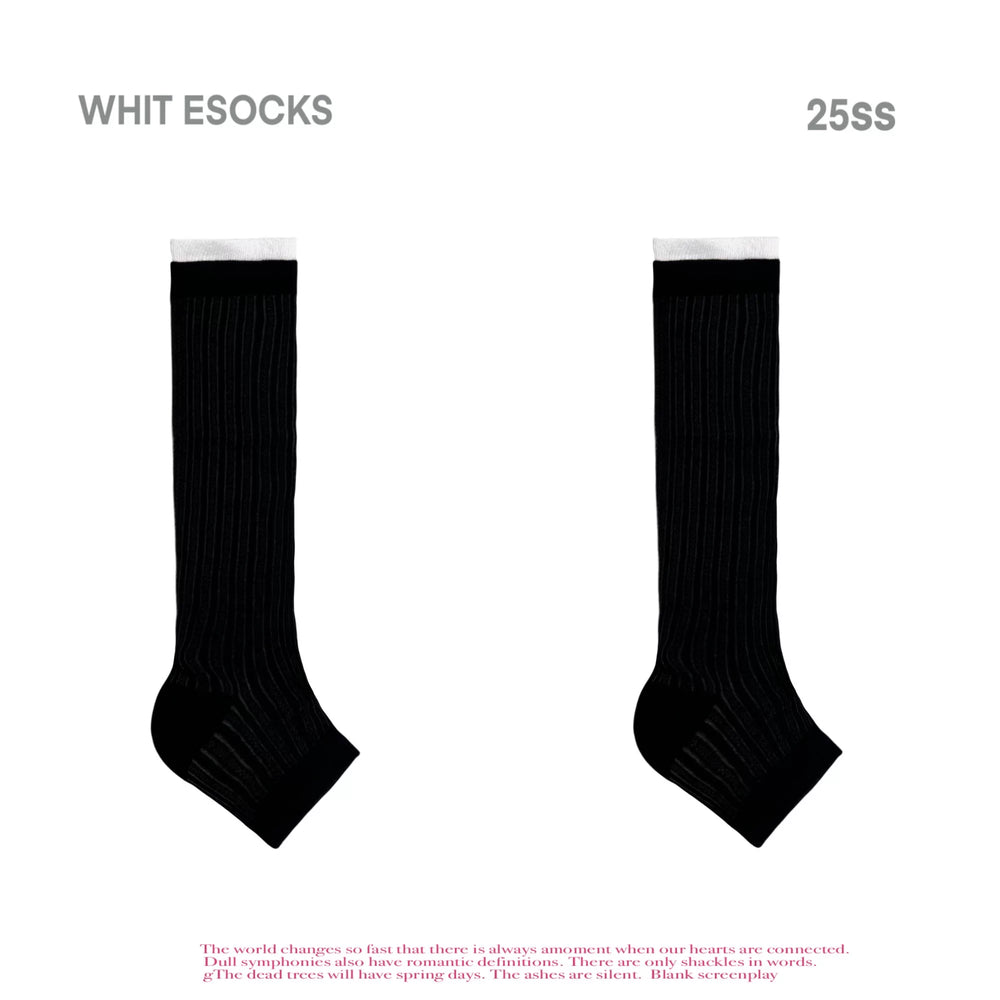 Black and grey striped mid-calf socks shown on legs with black sandals