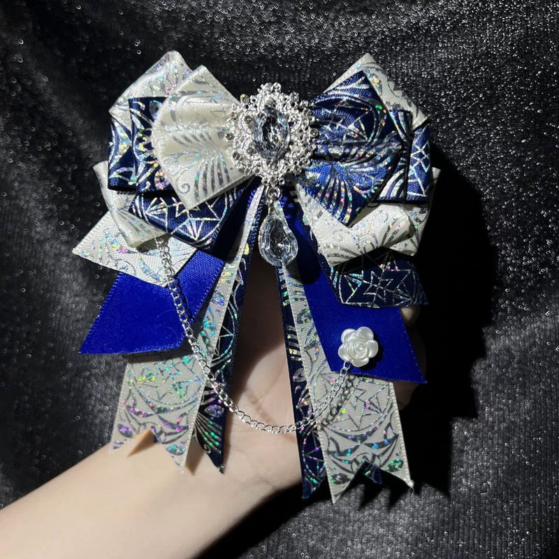 xxc230589 - Snowflake Diamond Bow - Layered bow brooch with a dangling chain