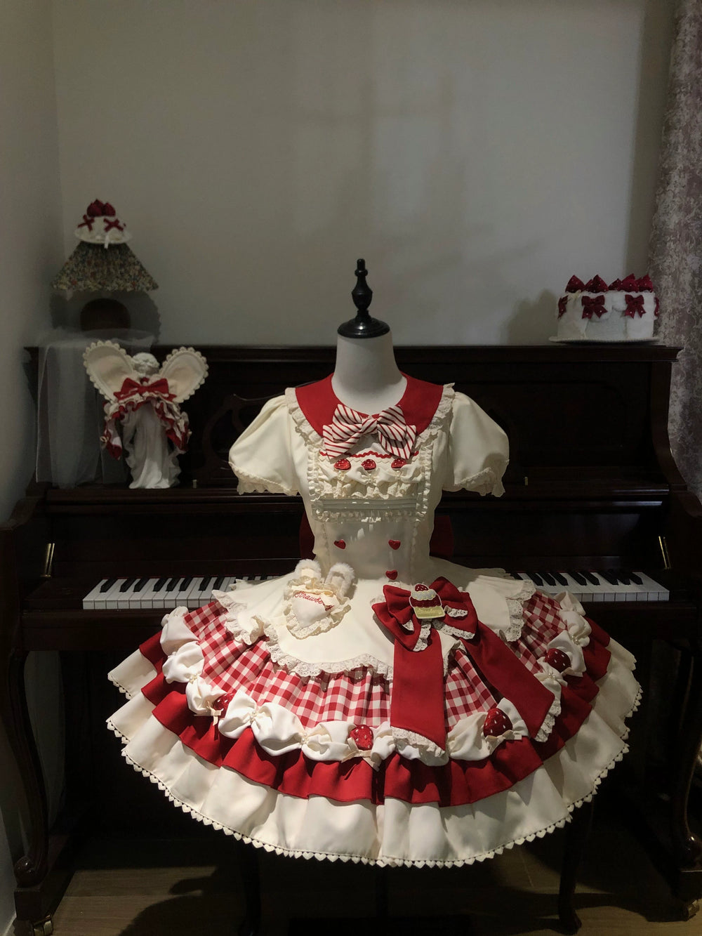 Red and cream OP dress with layered ruffles, bows and dessert details