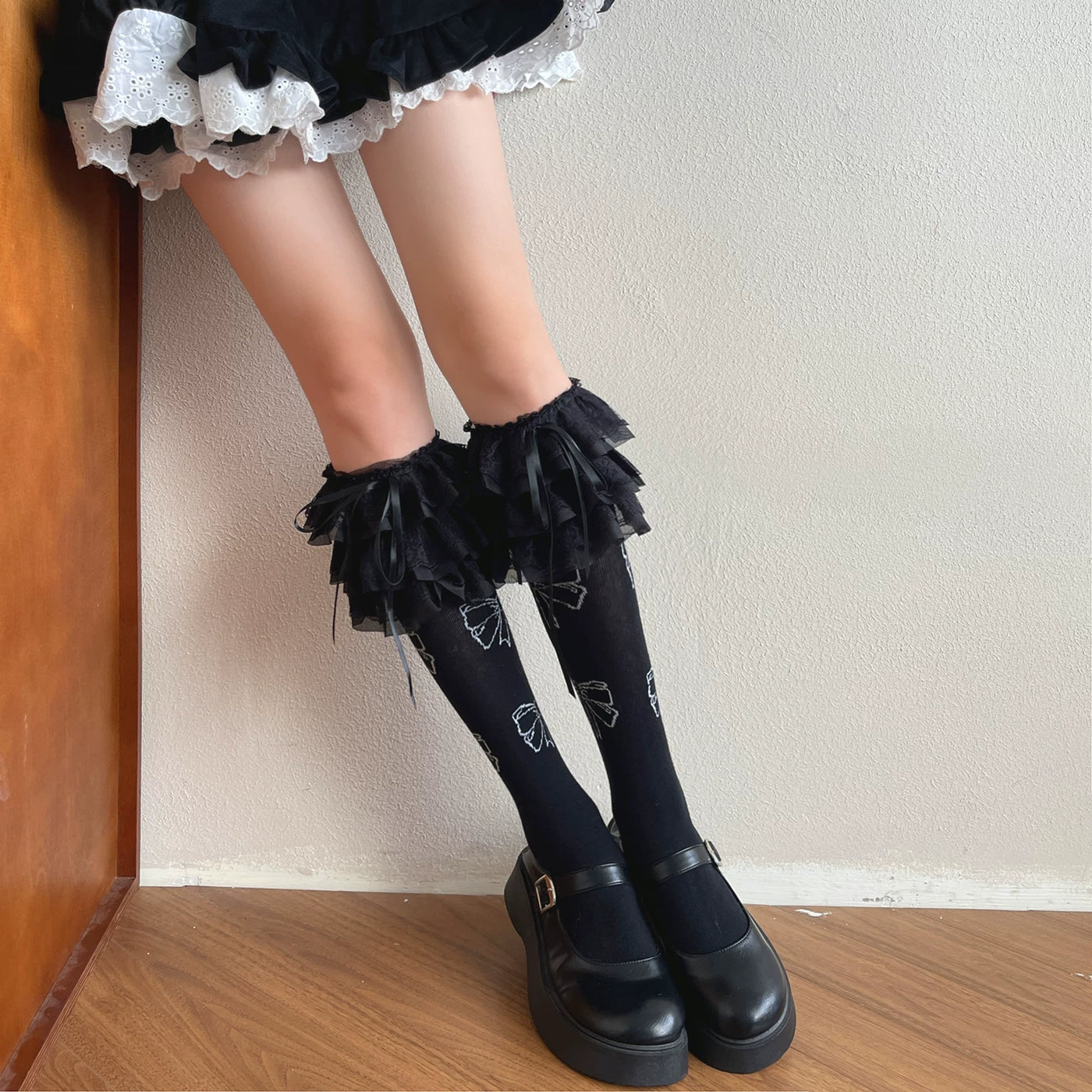 White Sweet Lolita mid-calf sock with tiered lace ruffle cuff and bow details