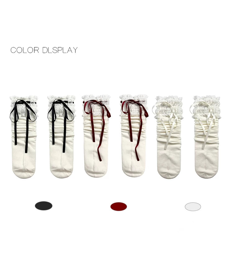 White lace-trimmed socks with black, red and white ribbon-bow options in a product display
