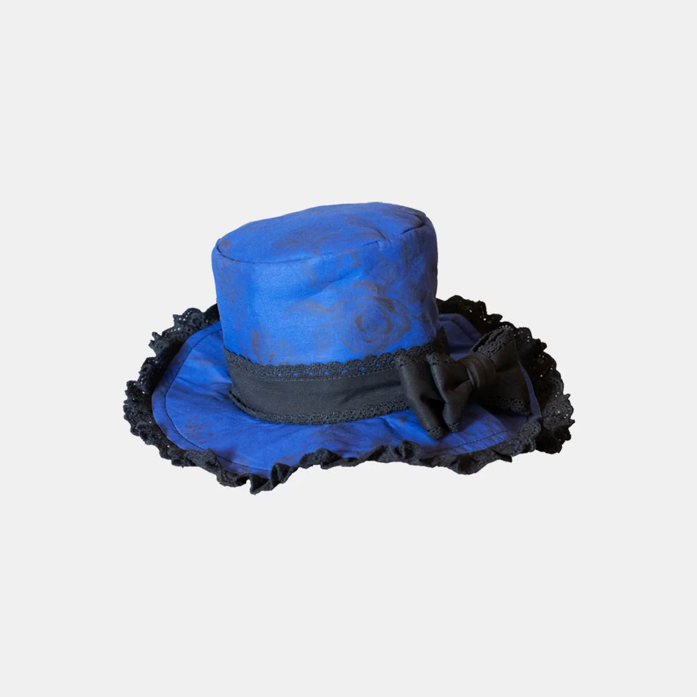Blue top hat and blue-black lace accessory pieces on light backgrounds
