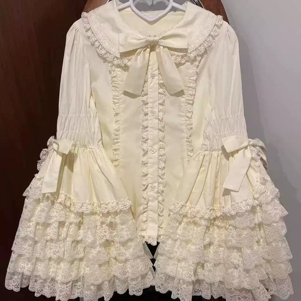 White sweet lolita lace blouse with bell sleeves, scalloped lace trim, and included neck bow