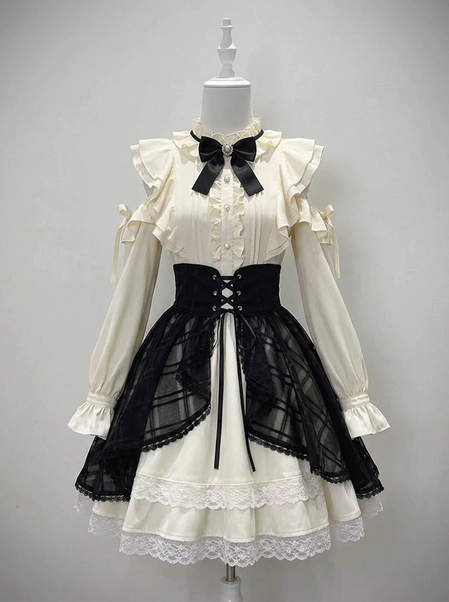 White one-piece Lolita dress with black lace-up overskirt on a mannequin