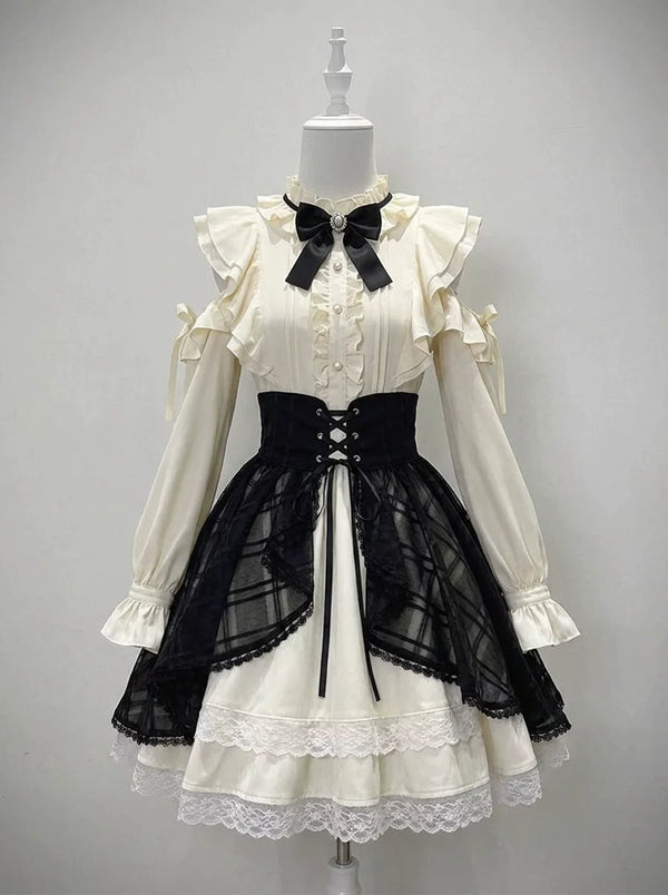 White one-piece Lolita dress with black lace-up overskirt on a mannequin