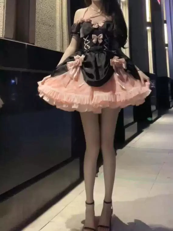 Black-and-pink ruffled dress with floral accents and a long rear train, front and back views