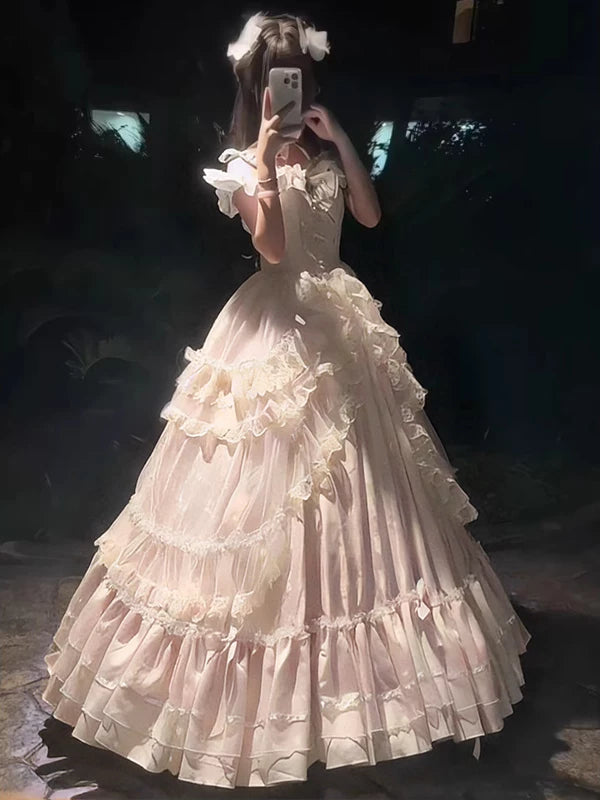 Pink Lolita ballgown with tiered ruffled skirt, worn with underskirt support, front view