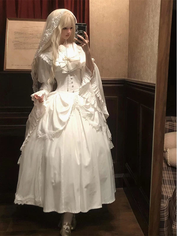 White gothic Lolita blouse and long skirt set with princess sleeves and bib.