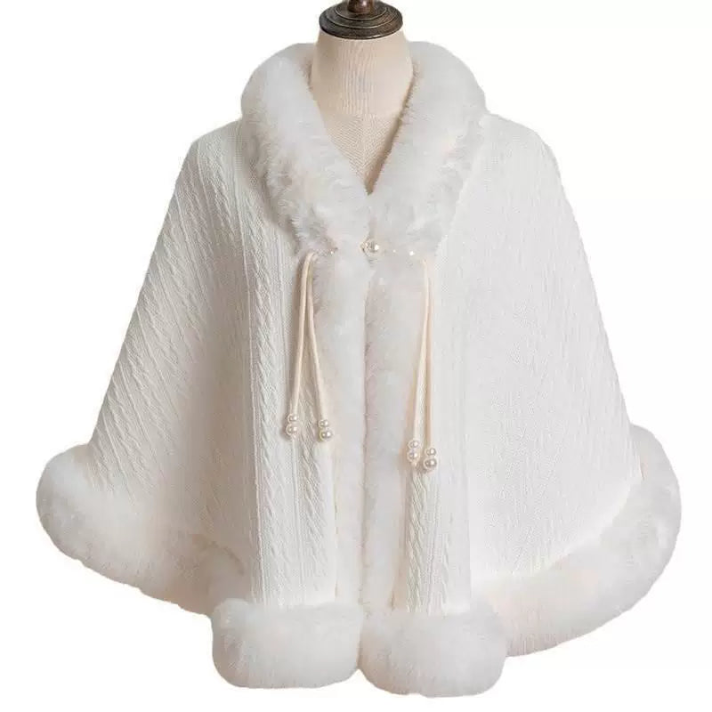 White plush Lolita cape worn over a pale blue dress