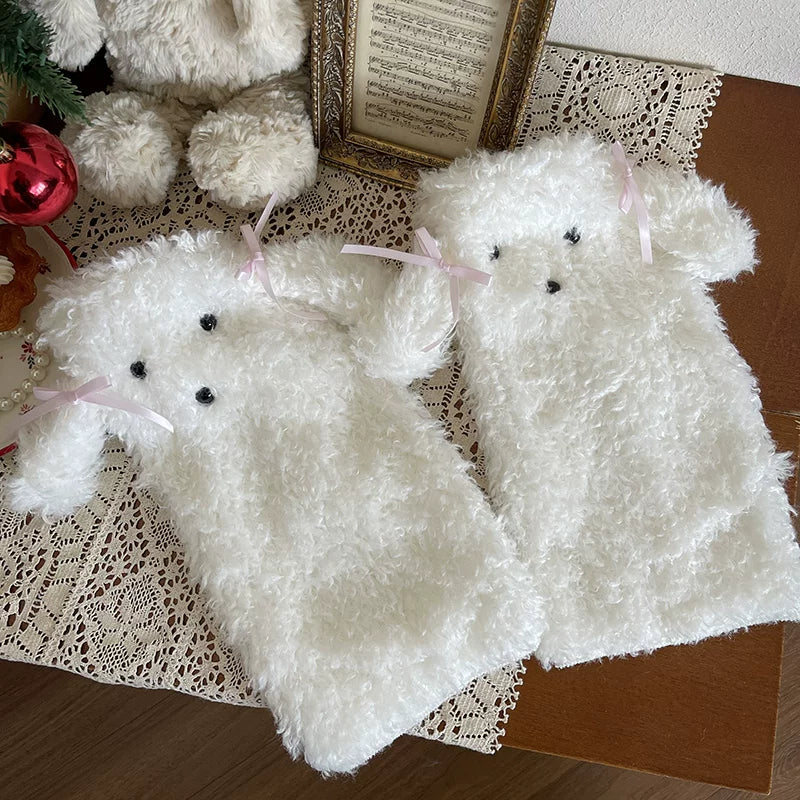White furry dog sock covers with red bows styled over fine-striped tights