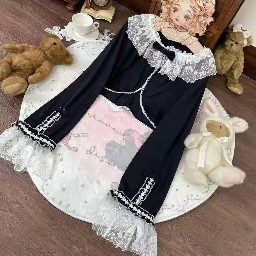 White and black long-sleeve outer layers with doll collars and lace trim shown on a rack and mannequin.