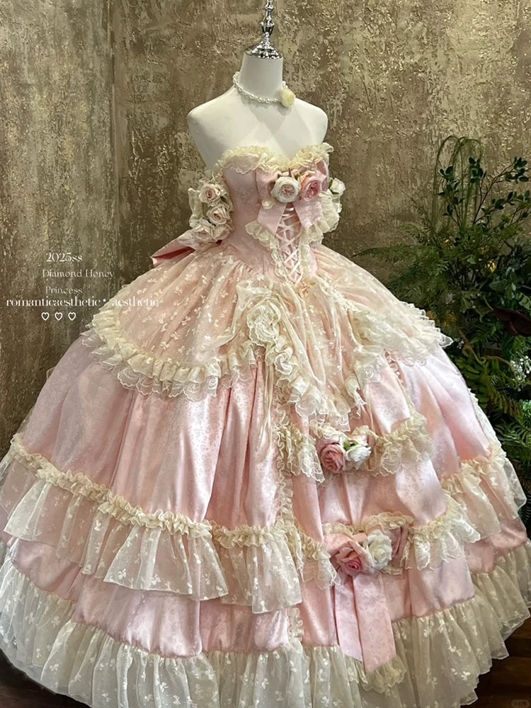 Back view of Flora Muse pink Lolita gown showing corset-style lacing and structured tiered skirt