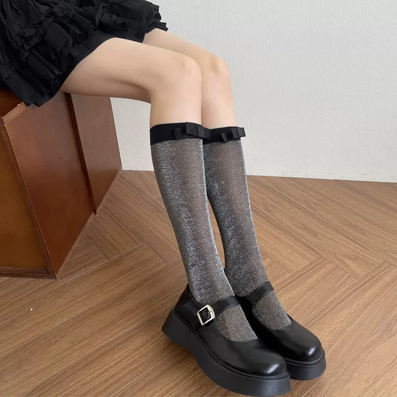 Light gray glittery mid-calf socks with white bow accents