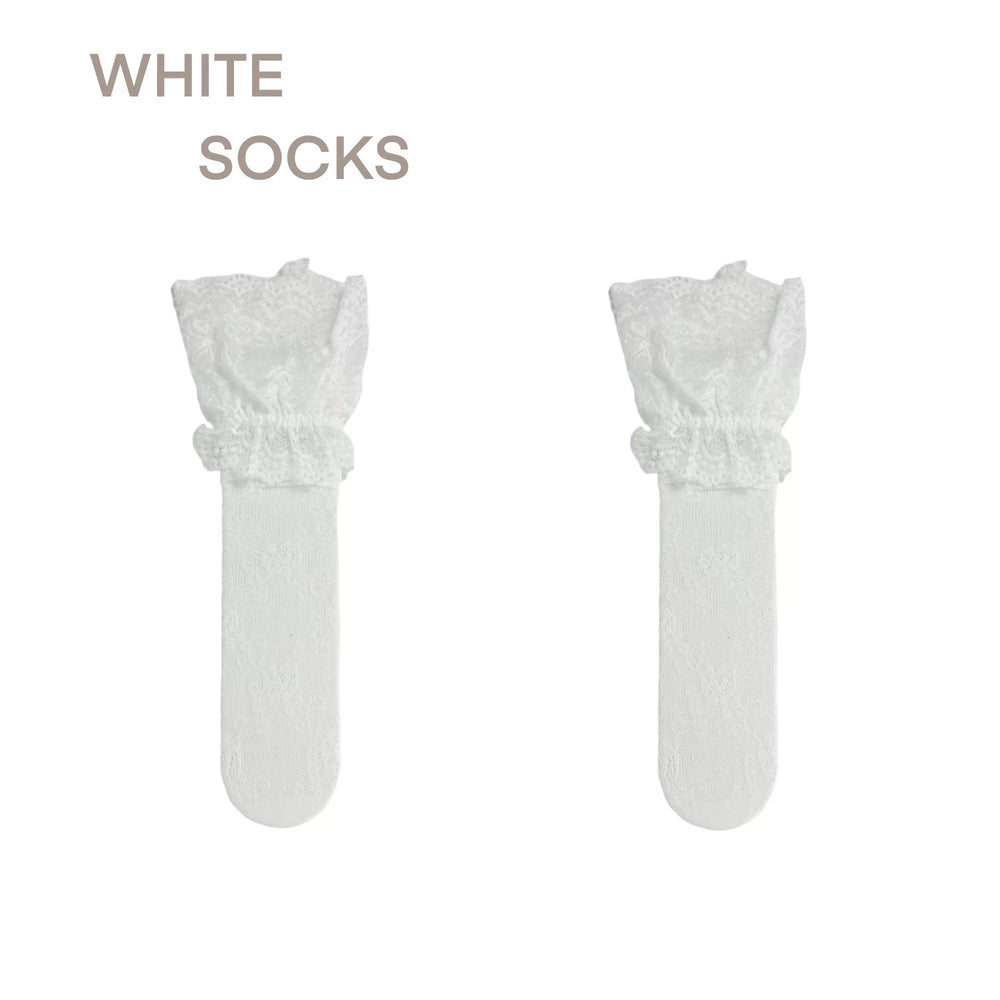 Sheer black mid-calf sock with floral lace cuff, scattered white dot and silver butterfly embellishments, styled with red Mary Jane ballet flats